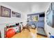 Home gym featuring treadmill, stationary bicycle, weights and exercise ball at 4856 S Quintero Cir, Aurora, CO 80015