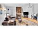 Inviting living area with a fireplace and neutral decor at 4856 S Quintero Cir, Aurora, CO 80015