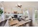 Bright living room with a cozy fireplace, built-in shelving, and stylish decor at 9182 Ridgegate Pkwy, Lone Tree, CO 80124