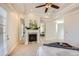 Comfortable main bedroom with mirrored wardrobe, fireplace, and ensuite bathroom at 9182 Ridgegate Pkwy, Lone Tree, CO 80124