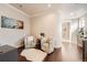 A cozy sitting area with hardwood floors, stylish chairs, and a decorative rug at 9182 Ridgegate Pkwy, Lone Tree, CO 80124