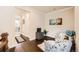 Comfortable sitting area features floral chairs, hardwood floors, and decor at 9182 Ridgegate Pkwy, Lone Tree, CO 80124