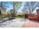 A backyard featuring a stone patio, lawn, and privacy fence and lattice at 1941 Fox Fire St, Highlands Ranch, CO 80129