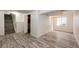 Finished basement featuring modern wood-look floors and a window for natural light at 1941 Fox Fire St, Highlands Ranch, CO 80129