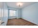 Bedroom painted light blue with carpet flooring and natural light from the window at 1941 Fox Fire St, Highlands Ranch, CO 80129