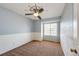 Two tone bedroom with ceiling fan and carpet flooring at 1941 Fox Fire St, Highlands Ranch, CO 80129