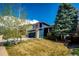 Landscaped front yard showcasing a two-story home with appealing curb appeal at 1941 Fox Fire St, Highlands Ranch, CO 80129