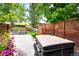 Hot tub on a stone patio overlooking the backyard at 1941 Fox Fire St, Highlands Ranch, CO 80129