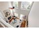 Aerial view of a light, bright living room with fireplace, hardwood floors, and sliding glass doors to the deck at 1941 Fox Fire St, Highlands Ranch, CO 80129