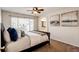 Comfortable main bedroom with a ceiling fan, natural lighting, and neutral tones creating a relaxing atmosphere at 1941 Fox Fire St, Highlands Ranch, CO 80129