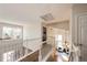 View from the upper level of the home showcasing the foyer, a light fixture, and staircase at 1941 Fox Fire St, Highlands Ranch, CO 80129