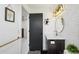 Modern bathroom featuring a sleek vanity, oval mirror, and stylish herringbone tile accent wall at 21434 E Greenwood Pl, Aurora, CO 80013