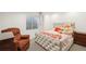 Cozy bedroom with a tufted bed, soft lighting, and comfortable reading nook at 21434 E Greenwood Pl, Aurora, CO 80013
