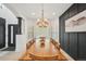 Elegant dining room showcasing a wooden table, contemporary lighting, and stylish wall accents at 21434 E Greenwood Pl, Aurora, CO 80013