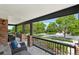Inviting front porch with comfortable seating, brick columns, and a view of the neighborhood at 21434 E Greenwood Pl, Aurora, CO 80013