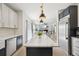Open-concept kitchen flows seamlessly into the living area with views of the fireplace and backyard at 21434 E Greenwood Pl, Aurora, CO 80013