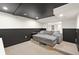 Spacious basement living room with comfortable seating and modern design elements at 21434 E Greenwood Pl, Aurora, CO 80013