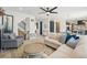 Bright and airy living room with hardwood floors and access to staircase and open concept rooms at 21434 E Greenwood Pl, Aurora, CO 80013