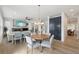 Open-concept layout with a living room, dining area, and seamless access to the staircase at 21434 E Greenwood Pl, Aurora, CO 80013