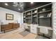 Stylish office area with ample storage, modern decor, and great natural light at 21434 E Greenwood Pl, Aurora, CO 80013