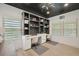 Bright office featuring built-in shelving, dual desks, and contemporary design at 21434 E Greenwood Pl, Aurora, CO 80013