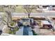 Aerial view showcasing the property's layout, including the yard, pergola, and surrounding neighborhood at 7785 E 13Th Ave, Denver, CO 80220