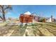 Brick house displaying modern fencing, side yard, and partial roof at 7785 E 13Th Ave, Denver, CO 80220