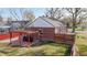Cozy backyard featuring a pergola-covered patio with outdoor seating, surrounded by a well-maintained lawn and fencing at 7785 E 13Th Ave, Denver, CO 80220