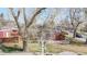 Lovely brick house presenting a neat lawn with stone-lined walkway and stylish horizontal fence, boosting curb appeal at 7785 E 13Th Ave, Denver, CO 80220
