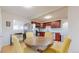 Open eat-in kitchen with modern stainless steel appliances, updated cabinets, and neutral backsplash at 7785 E 13Th Ave, Denver, CO 80220