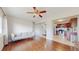 Bright living room with hardwood floors, modern furniture, and an open layout leading to the kitchen at 7785 E 13Th Ave, Denver, CO 80220