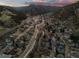 Stunning aerial view of a mountain town nestled in a valley at 2041 Virginia St, Idaho Springs, CO 80452