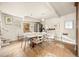 Well-lit dining area with a large table, tile flooring, and easy access to the kitchen at 2041 Virginia St, Idaho Springs, CO 80452