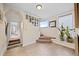 Bright entryway with stairs, tile flooring, a plant, and a view to the next room at 2041 Virginia St, Idaho Springs, CO 80452