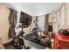 Home gym featuring workout equipment including a treadmill, stationary bike and rowing machine at 2041 Virginia St, Idaho Springs, CO 80452