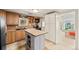 Traditional kitchen featuring wooden cabinets, black appliances, butcher block island and tile floors at 2041 Virginia St, Idaho Springs, CO 80452