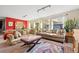 Inviting living room featuring a large sectional sofa, stylish rug, and lots of natural light through the windows at 2041 Virginia St, Idaho Springs, CO 80452