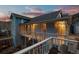 Spacious porch with white railings, outdoor seating, a fire pit, and scenic views, perfect for relaxation at 2041 Virginia St, Idaho Springs, CO 80452