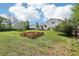 Large backyard featuring garden boxes and a well-maintained lawn at 235 Summit Cir, Lafayette, CO 80026