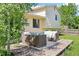 Backyard featuring an outdoor patio set on a wooden deck and lush green grass at 235 Summit Cir, Lafayette, CO 80026