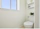 Clean, well-lit half bath with a white toilet, and white walls for a refreshing feel at 235 Summit Cir, Lafayette, CO 80026