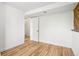 Bright bedroom with light hardwood floors and neutral-toned walls, providing a simple and airy atmosphere at 235 Summit Cir, Lafayette, CO 80026