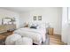 Bright, minimalist bedroom with a comfortable bed, stylish accents, and natural light for a peaceful retreat at 235 Summit Cir, Lafayette, CO 80026