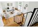 Overhead shot of naturally lit living room with hardwood floors and neutral furniture at 235 Summit Cir, Lafayette, CO 80026