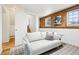 Stylish living room with wood paneling and a comfortable couch, offering a relaxing space at 235 Summit Cir, Lafayette, CO 80026