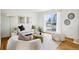 Bright living room featuring hardwood floors, a neutral color palette, and large windows at 235 Summit Cir, Lafayette, CO 80026