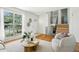 Bright living area featuring hardwood floors, staircase, and a large window at 235 Summit Cir, Lafayette, CO 80026