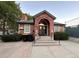 Community clubhouse with brick and siding exterior, easy access, and lovely landscaping at 4933 S Carson St # 212, Aurora, CO 80015