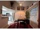 Charming dining area with adjacent kitchen featuring stainless steel appliances and modern finishes at 4933 S Carson St # 212, Aurora, CO 80015