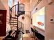 Inviting living room with spiral staircase and open concept design at 4933 S Carson St # 212, Aurora, CO 80015